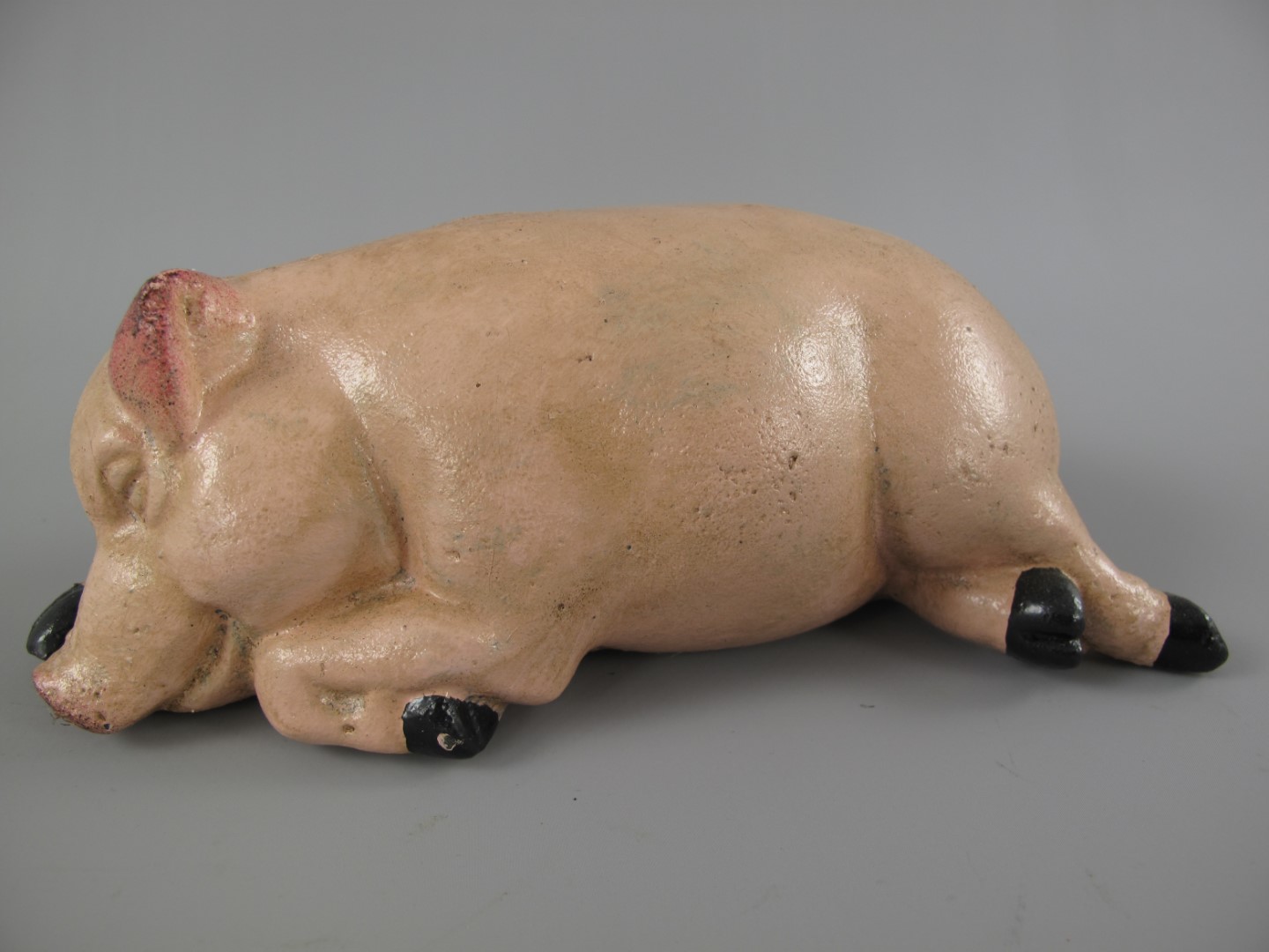 Sparschwein Schläfend Eisen farbig L.18x10cm